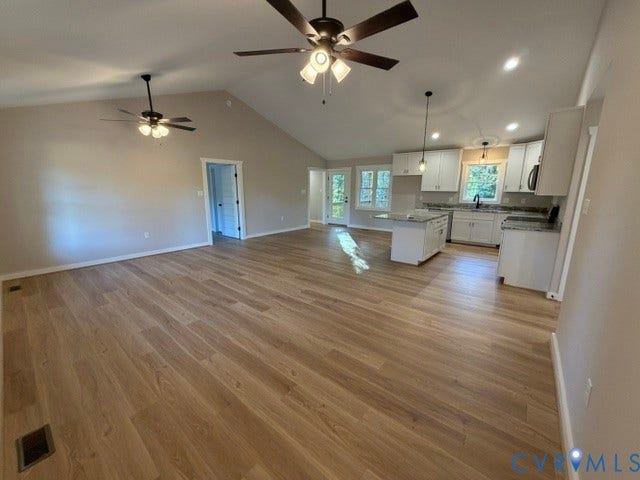 745 Gully Tavern Road, Detached, Rice, VA 23966 Vaulted ceilings with dual ceiling fans, wood-finish flooring, white cabinetry, a kitchen island, and recessed lighting