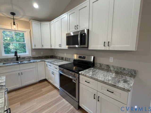 745 Gully Tavern Road, Detached, Rice, VA 23966 Kitchen featuring white Shaker-style cabinetry, patterned stone-surface countertops, stainless steel appliances, wood-finish flooring, and a single-handle matte black faucet
