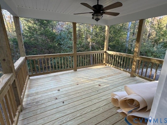 745 Gully Tavern Road, Detached, Rice, VA 23966 Covered porch featuring wood decking, wood railing, beadboard ceiling, and a ceiling fan with integrated light fixture