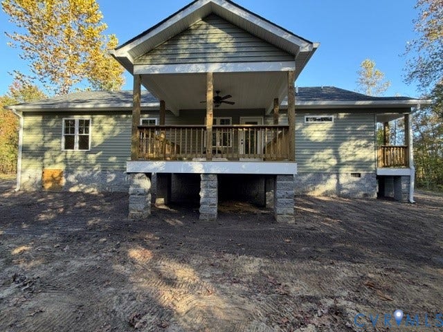 745 Gully Tavern Road, Detached, Rice, VA 23966 Exterior featuring green horizontal siding, a covered wooden deck with a built-in ceiling fan, and a masonry foundation with stacked stone pillars