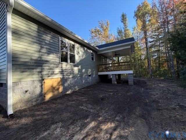 745 Gully Tavern Road, Detached, Rice, VA 23966 Exterior profile featuring horizontal siding, a concrete block foundation, a raised covered deck with a wooden railing, and a ceiling-mounted fan