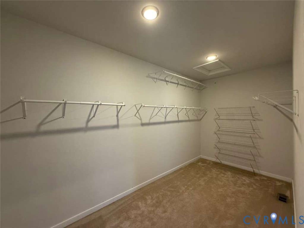 5912 Whitehurst Lane, #B, Henrico, VA 23227 Walk-in closet featuring wall-to-wall carpeting, multiple levels of white wire shelving, and overhead flush-mount lighting