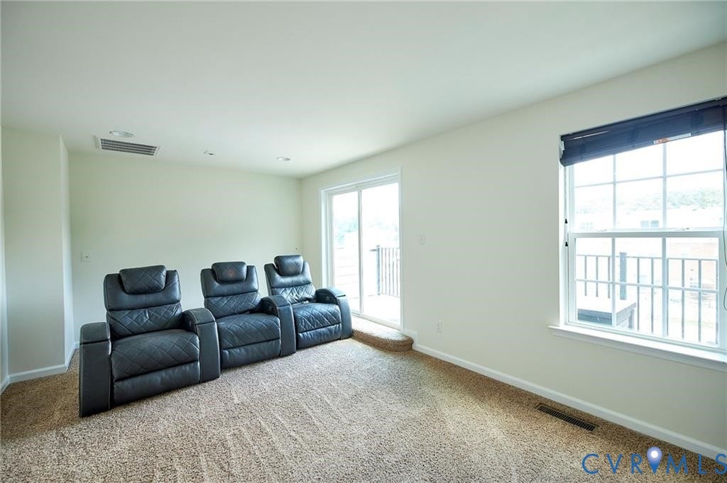 11316 Duncan park Court, Glen Allen, VA 23060 Interior space featuring neutral wall tones, wall-to-wall carpeting, recessed ceiling lighting, a single-hung window with a blind, and a sliding glass door providing external access