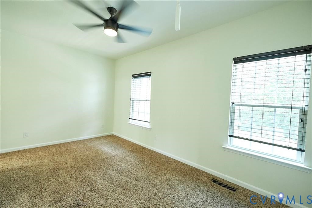 11316 Duncan park Court, Glen Allen, VA 23060 Room featuring wall-to-wall carpeting, dual windows with horizontal blinds, and a ceiling fan with integrated lighting