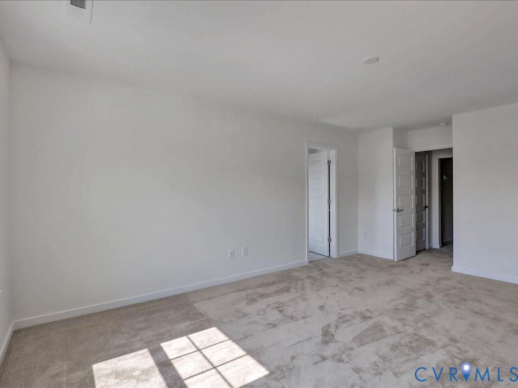 338 Hay Mill Alley, Glen Allen, VA 23060 Neutral interior featuring wall-to-wall carpeting, high-gloss white interior doors, and clean, minimalist wall finishes