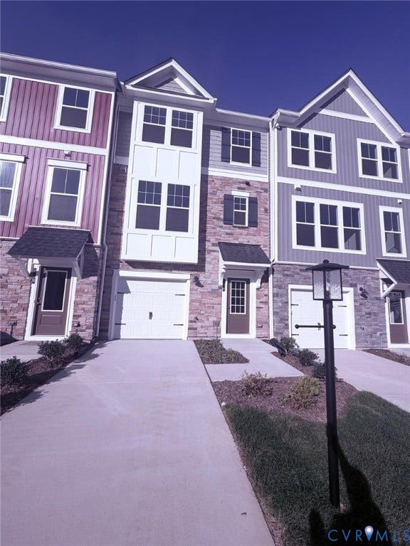 504 Sybil Street, Glen Allen, VA 23060 Multi-story exterior featuring stone veneer, vertical siding, multi-paned windows, and integrated garage access