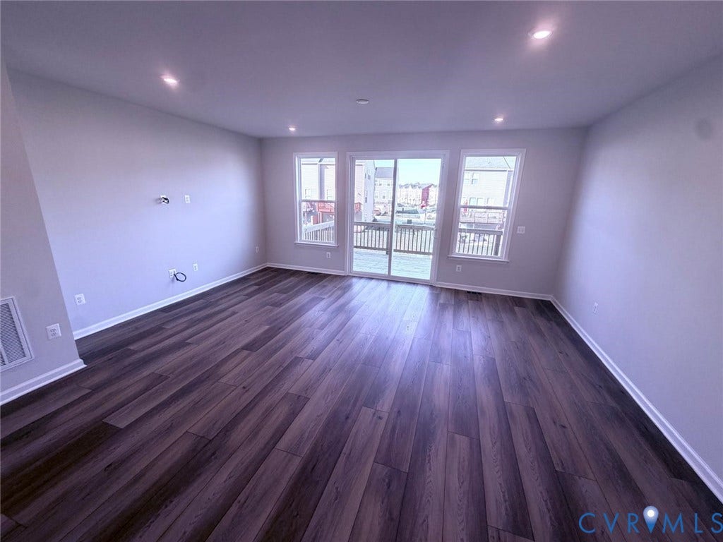 504 Sybil Street, Glen Allen, VA 23060 Open-concept room featuring wood-finish flooring, recessed lighting, double-hung windows, and sliding glass doors with exterior deck access