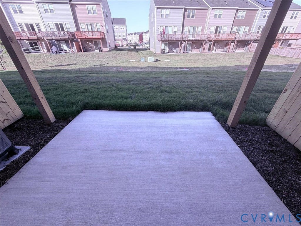 504 Sybil Street, Glen Allen, VA 23060 Concrete patio featuring wooden support beams and an open grass area