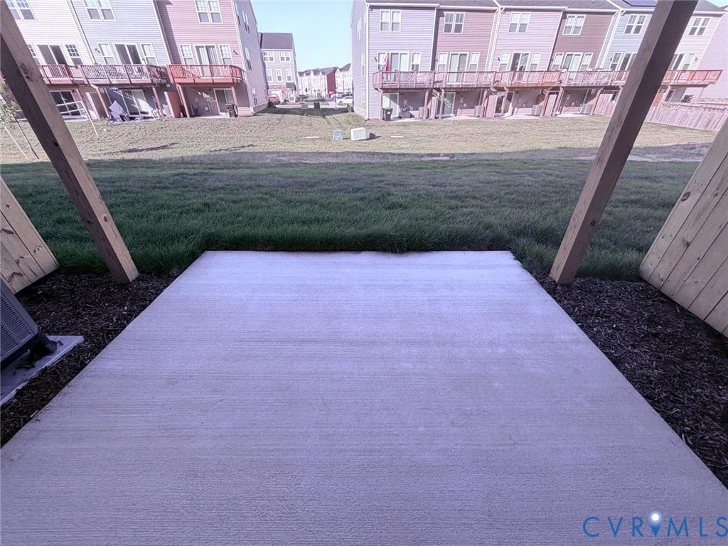 504 Sybil Street, Glen Allen, VA 23060 Concrete patio featuring wooden support beams and an open grass area