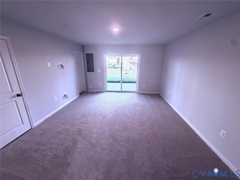 504 Sybil Street, Glen Allen, VA 23060 Neutral-toned room featuring wall-to-wall carpeting, recessed lighting, and sliding glass doors leading to the exterior