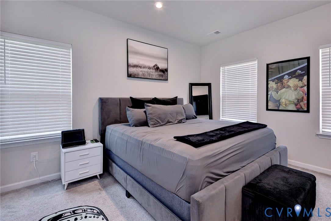 3415 Foxglove Drive, Toano, VA 23168 Neutral-toned interior room with wall-to-wall carpeting, recessed ceiling lighting, and three windows equipped with horizontal blinds