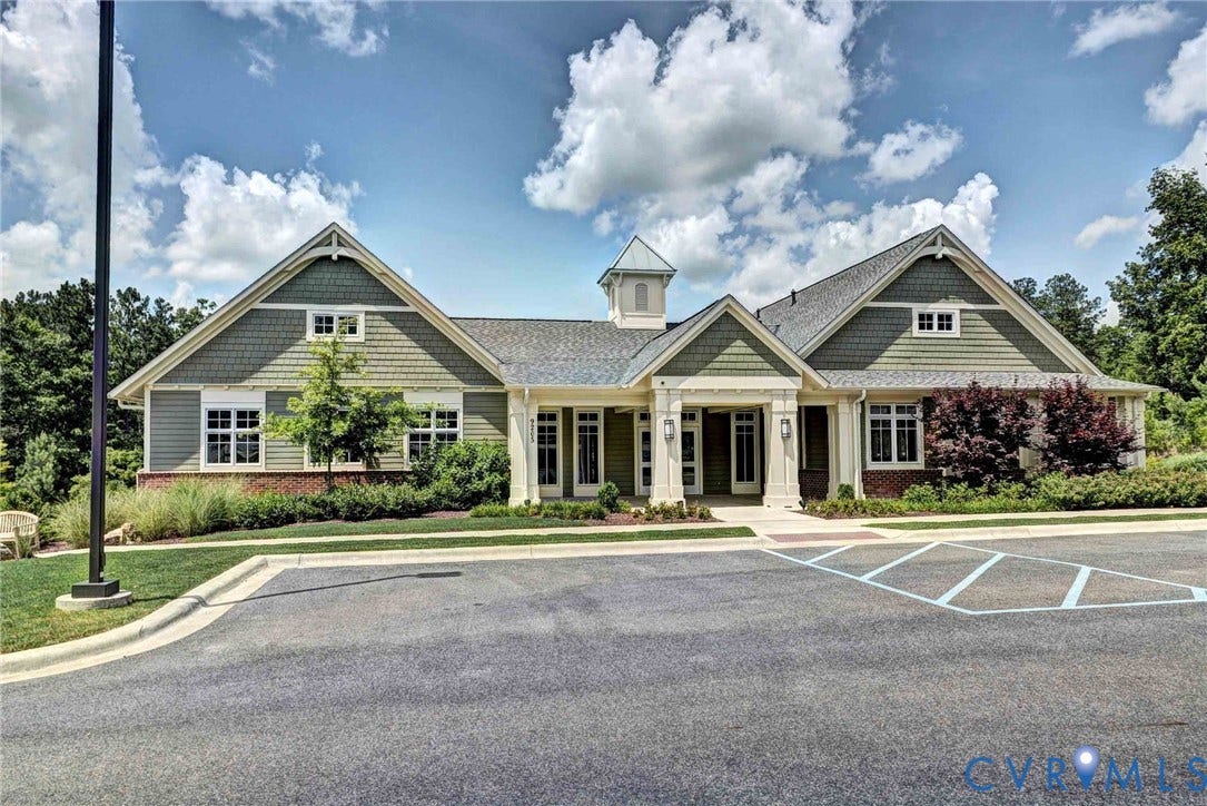 3415 Foxglove Drive, Toano, VA 23168 Craftsman-style exterior featuring shake siding, a central cupola, multi-gabled roofline, covered entryway with decorative columns, and brick foundation accents