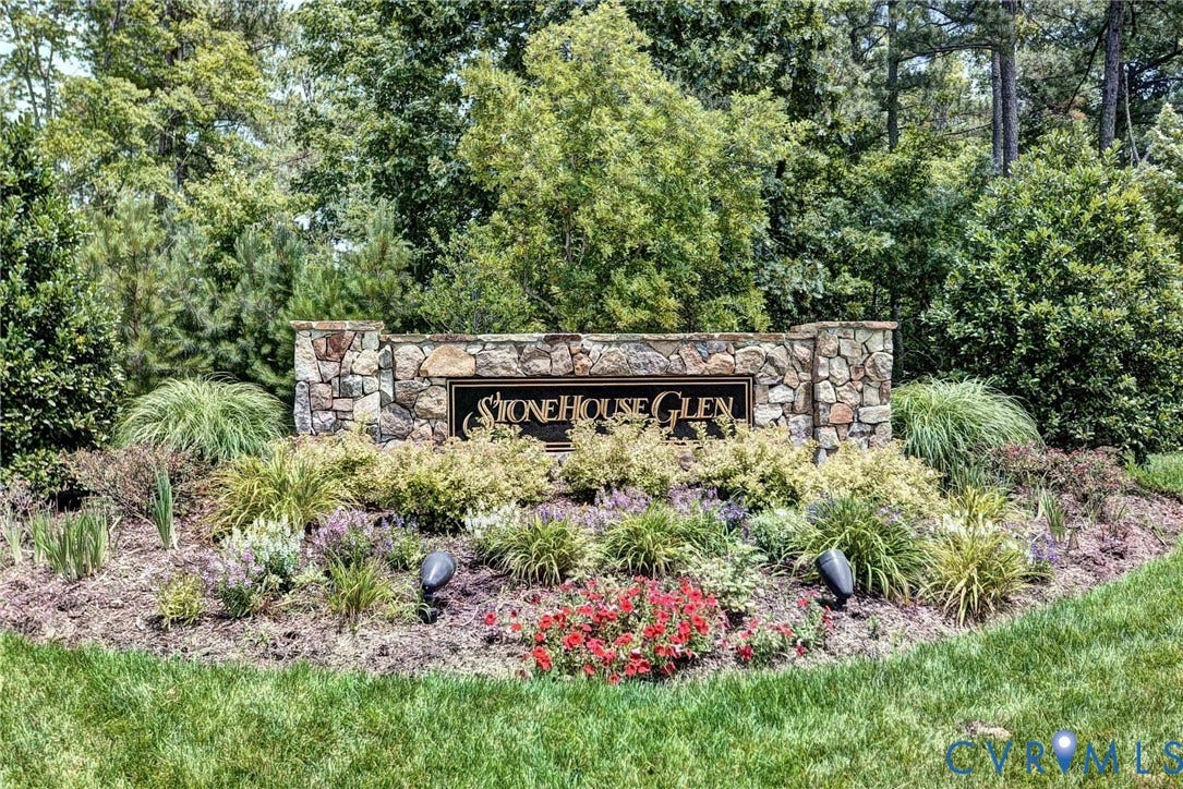 3415 Foxglove Drive, Toano, VA 23168 Stone masonry monument sign featuring integrated lighting and mature perennial landscaping
