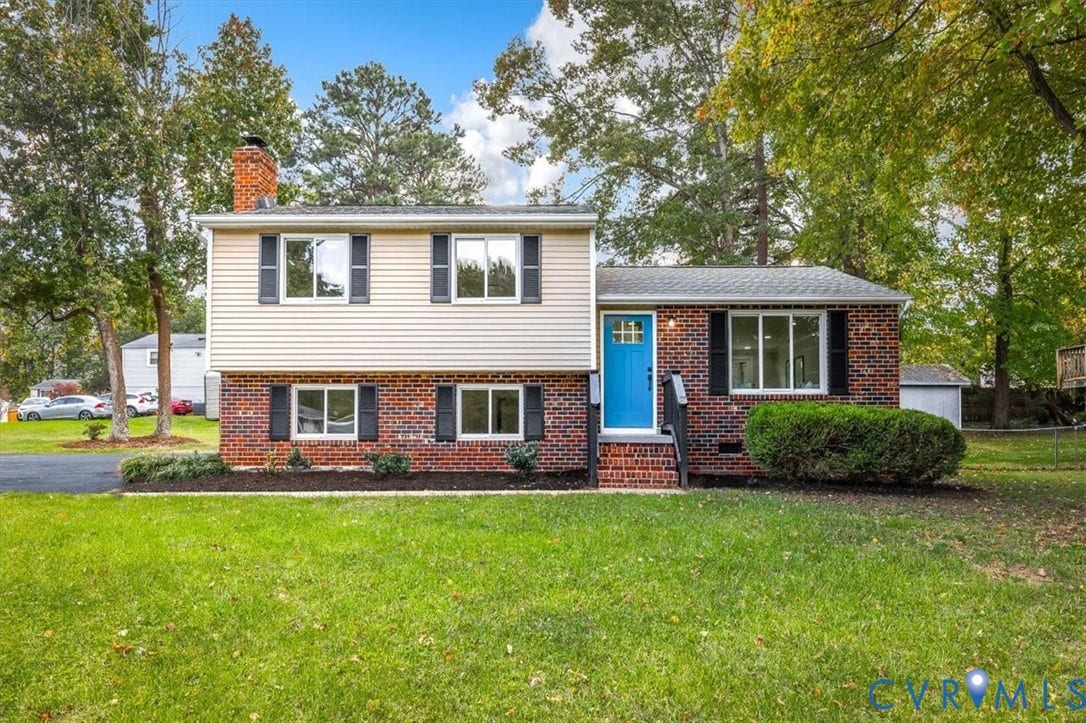 9201 Packard Court, Glen Allen, VA 23060 Multi-level exterior featuring a brick and horizontal siding facade, a front-entry door with glass detailing, and black decorative window shutters