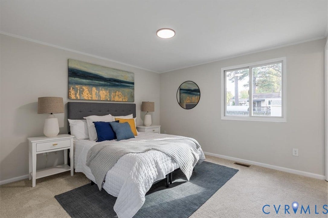 9201 Packard Court, Glen Allen, VA 23060 Neutral wall finishes, plush carpeting, and a wide-frame window providing natural illumination