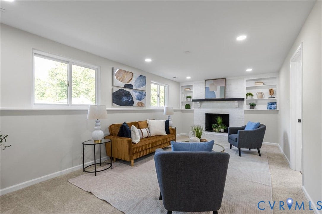 9201 Packard Court, Glen Allen, VA 23060 Living area featuring a fireplace with a painted brick surround, a dark wood mantel, recessed lighting, and built-in shelving