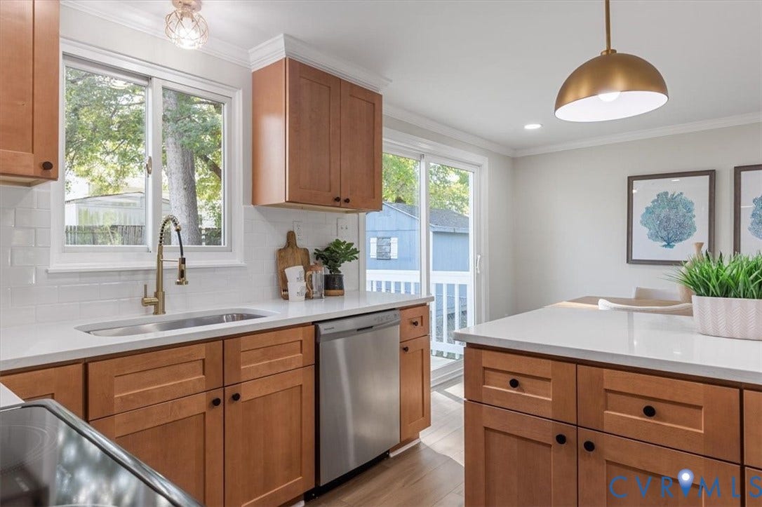 9201 Packard Court, Glen Allen, VA 23060 Kitchen featuring shaker-style cabinetry, quartz countertops, white subway tile backsplash, stainless steel dishwasher, and brass-tone pendant lighting