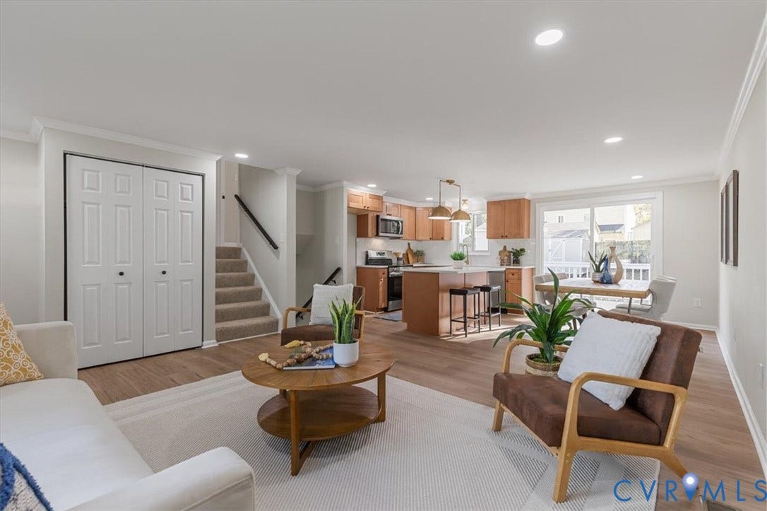 9201 Packard Court, Glen Allen, VA 23060 Open-concept interior featuring wood-finish flooring, recessed lighting, and a kitchen equipped with a central island and natural wood cabinetry