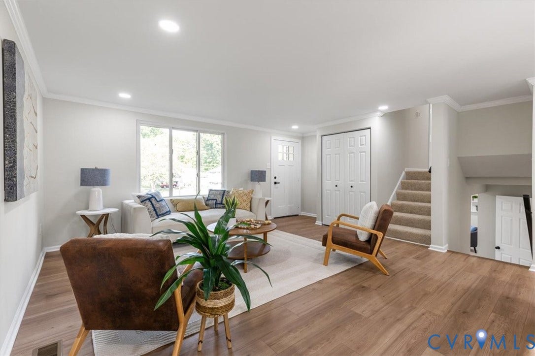 9201 Packard Court, Glen Allen, VA 23060 Neutral-toned interior featuring wood-finish flooring, recessed lighting, crown molding, double-door closet, and carpeted staircase