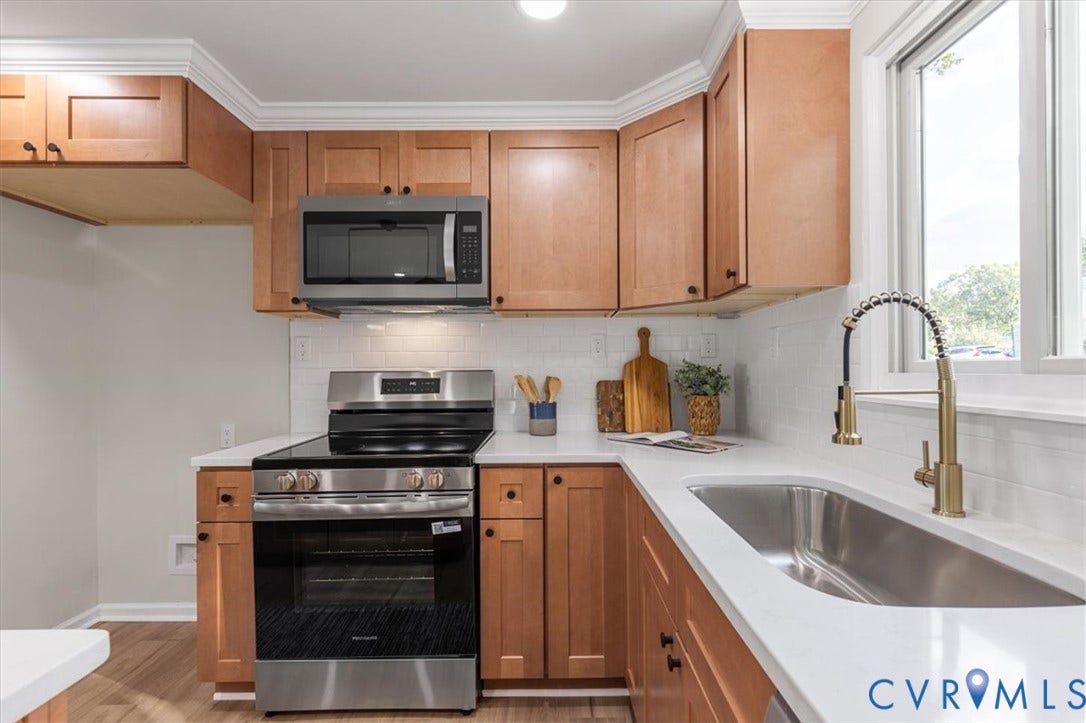 9201 Packard Court, Glen Allen, VA 23060 Kitchen featuring shaker-style wood cabinetry, white quartz countertops, white subway tile backsplash, stainless steel appliances, and a gooseneck faucet