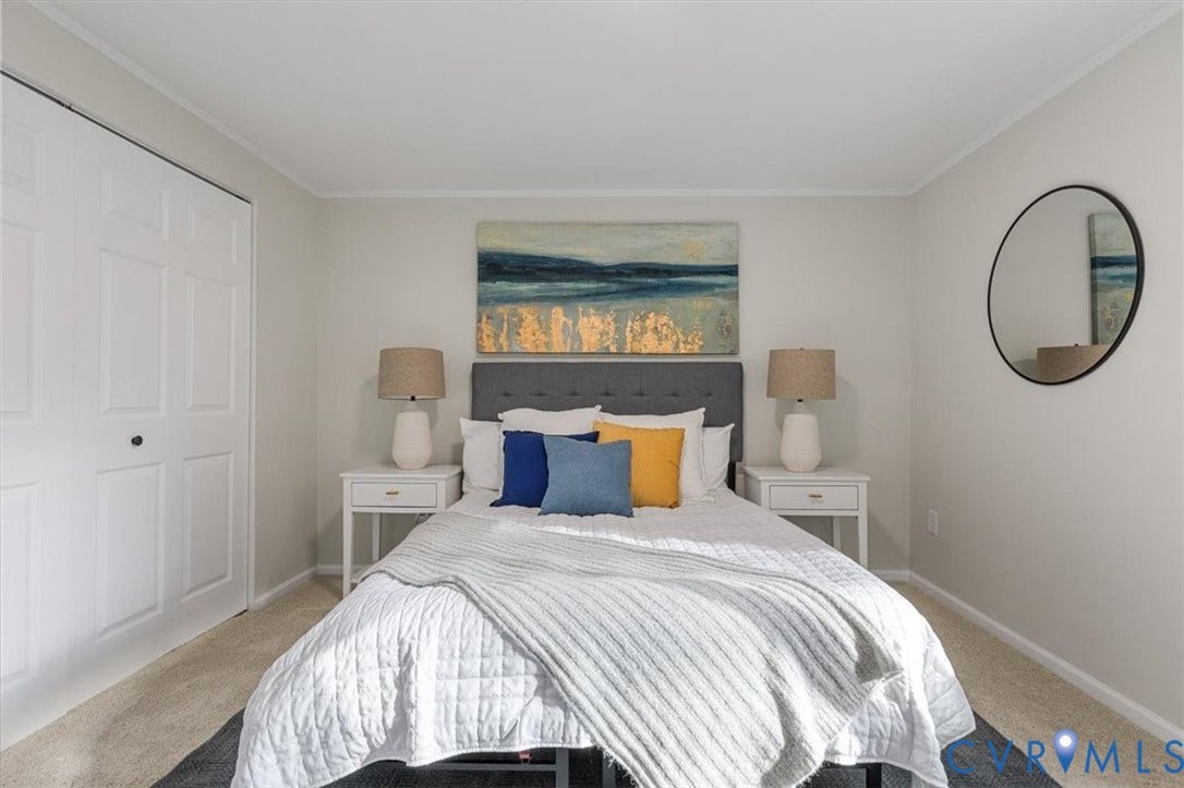 9201 Packard Court, Glen Allen, VA 23060 Neutral-toned bedroom featuring wall-to-wall carpeting and a bi-fold closet door