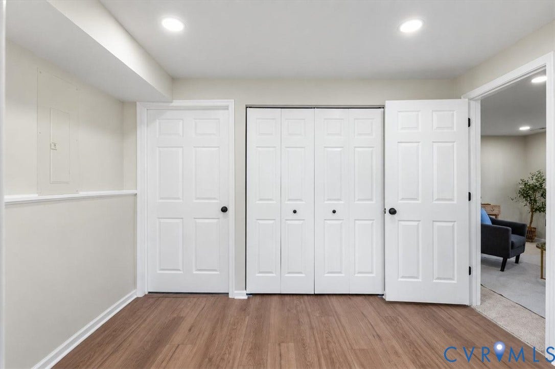 9201 Packard Court, Glen Allen, VA 23060 Wood-finish flooring, six-panel interior doors, bi-fold closet doors, and recessed lighting