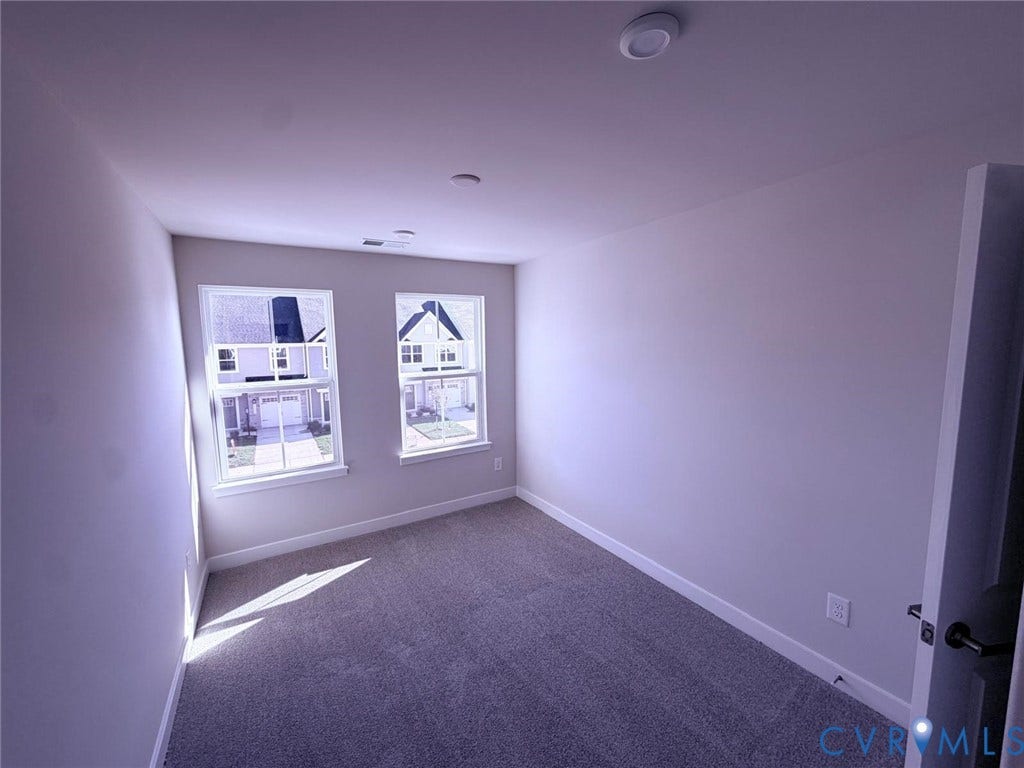 10600 Pink lily Lane, Chesterfield, VA 23234 Neutral-toned interior space featuring wall-to-wall carpeting, two double-hung windows, and recessed ceiling lighting
