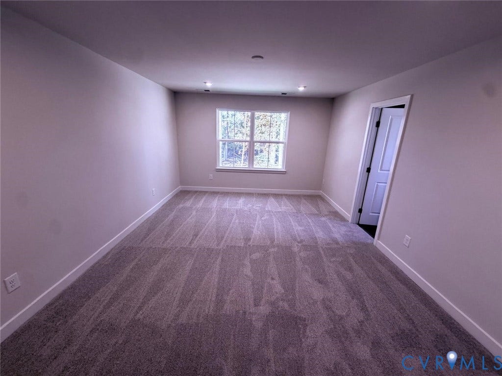 10600 Pink lily Lane, Chesterfield, VA 23234 Neutral-toned interior featuring wall-to-wall carpeting, recessed ceiling lighting, and a multi-pane window