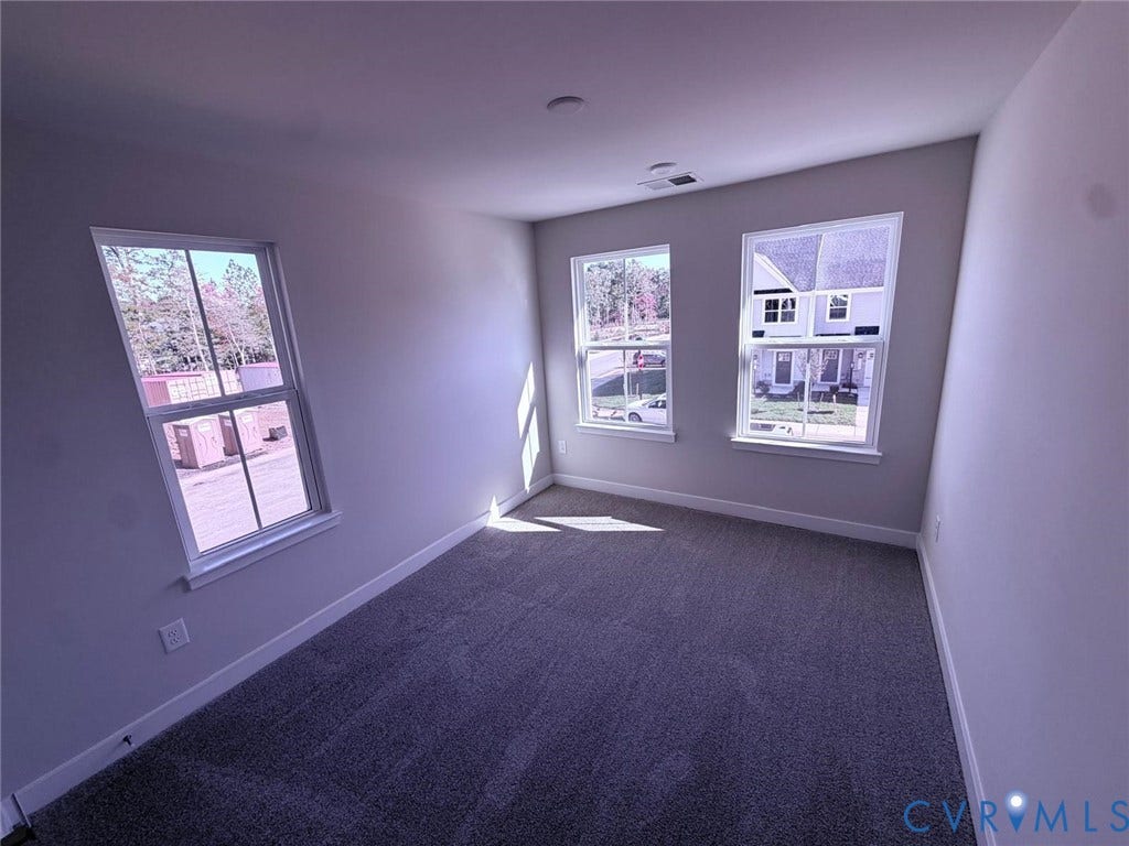 10600 Pink lily Lane, Chesterfield, VA 23234 Neutral interior featuring wall-to-wall carpeting and three multi-pane windows
