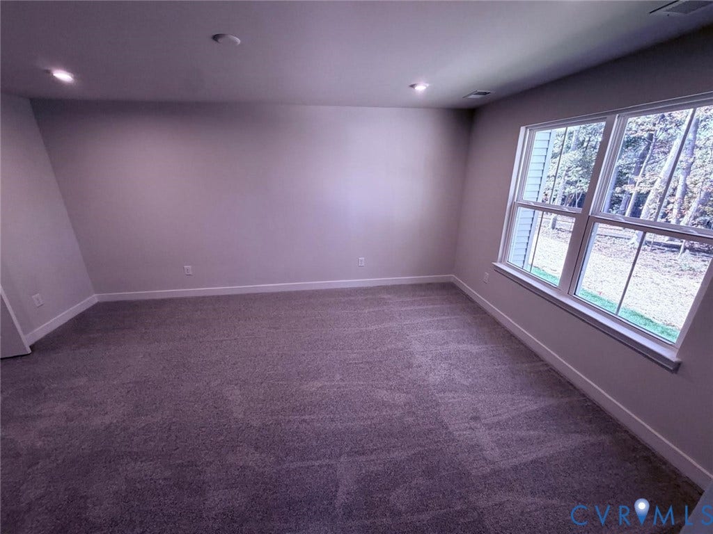 10600 Pink lily Lane, Chesterfield, VA 23234 Neutral-toned interior space featuring recessed ceiling lighting, wall-to-wall carpeting, and a large double-hung window