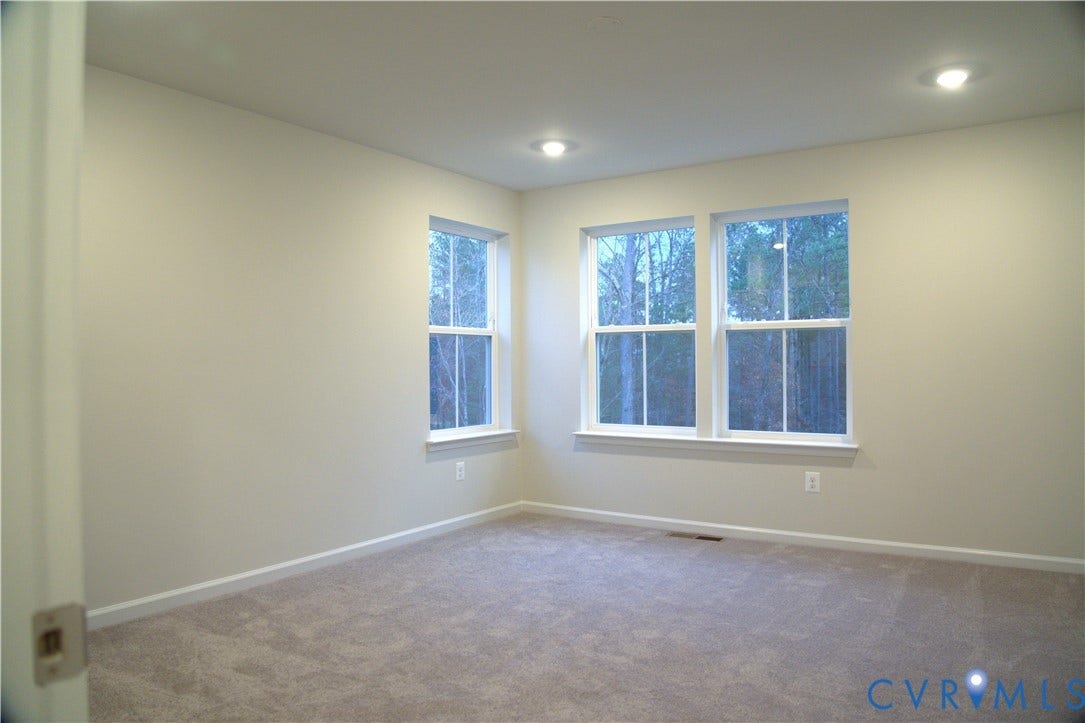 16005 Abelson Way, Chesterfield, VA 23832 Neutral-toned interior space featuring wall-to-wall carpeting, recessed ceiling lighting, and three double-hung windows