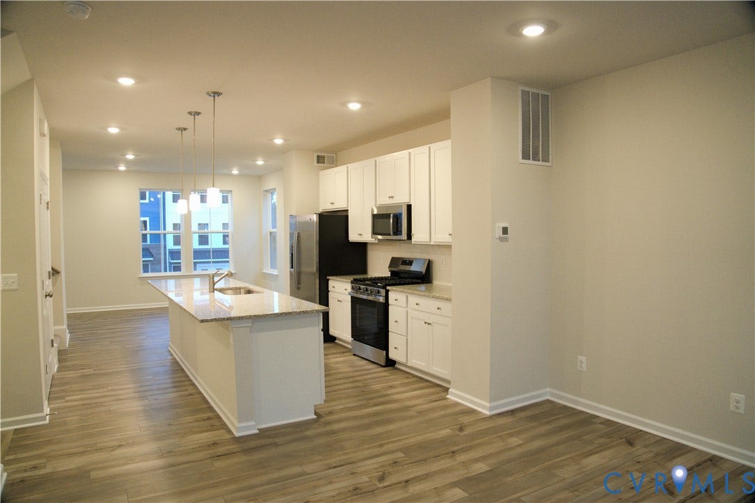 16005 Abelson Way, Chesterfield, VA 23832 Kitchen featuring white cabinetry, stone-finish countertops, stainless steel appliances, a center island with pendant lighting, and wood-finish flooring