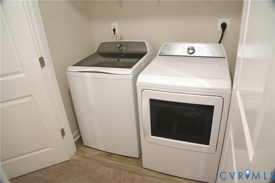 16005 Abelson Way, Chesterfield, VA 23832 Laundry area featuring white top-load washer and front-load dryer, neutral-toned wall paint, and white interior door