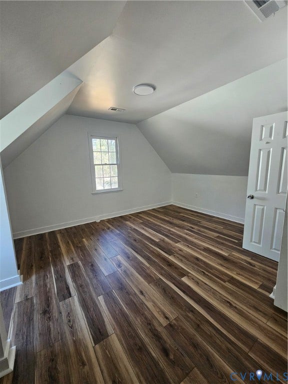 1219 Amber Forest Drive, Midlothian, VA 23114 Interior room featuring vaulted ceilings, wood-finish flooring, a single-pane window, and a white six-panel door