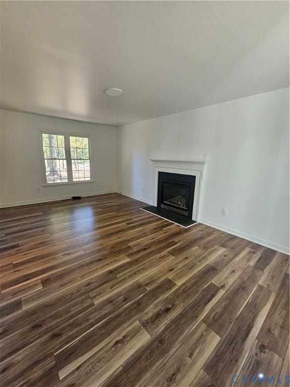 1219 Amber Forest Drive, Midlothian, VA 23114 Wood-finish flooring, fireplace with a white mantel, and double-pane window
