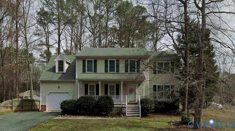 1219 Amber Forest Drive, Midlothian, VA 23114 Two-story exterior with light-colored siding, dark shutters, gabled roof, covered front porch, and attached garage