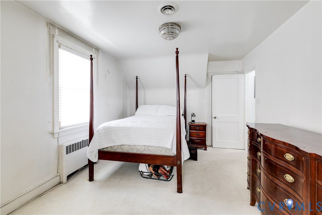 1406 Wentbridge Road, Richmond, VA 23227 Bedroom featuring neutral wall-to-wall carpeting, sloped ceiling architecture, single-panel interior door, and a multi-pane window