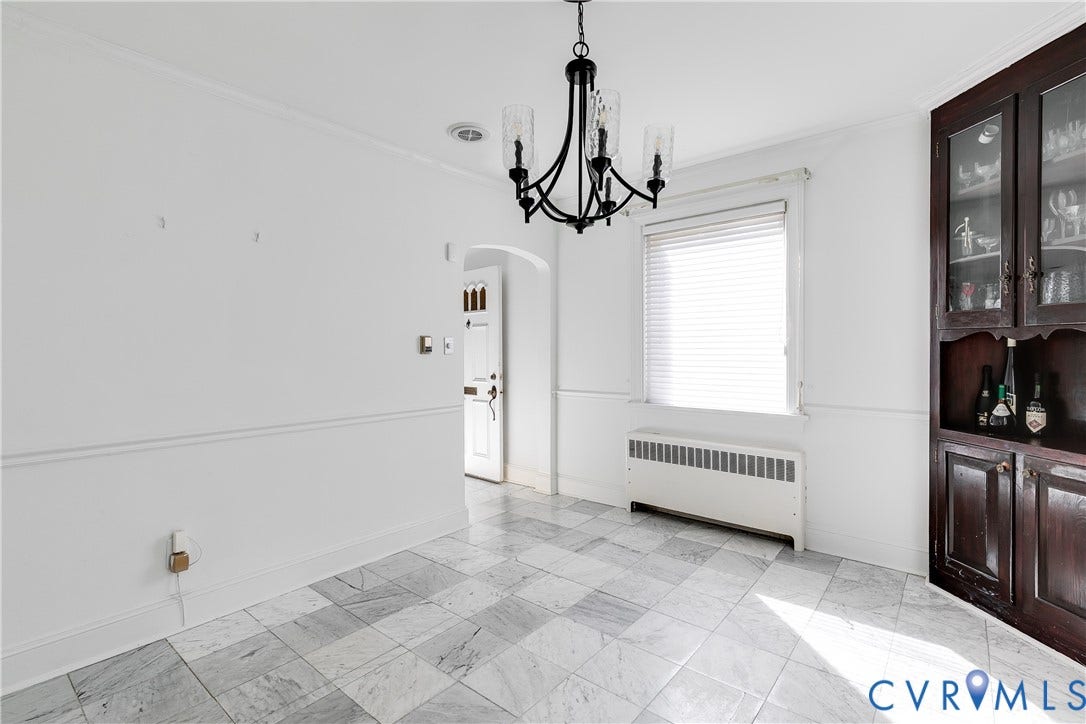 1406 Wentbridge Road, Richmond, VA 23227 Interior space featuring tile flooring, built-in dark wood cabinetry, a decorative chandelier, and crown molding