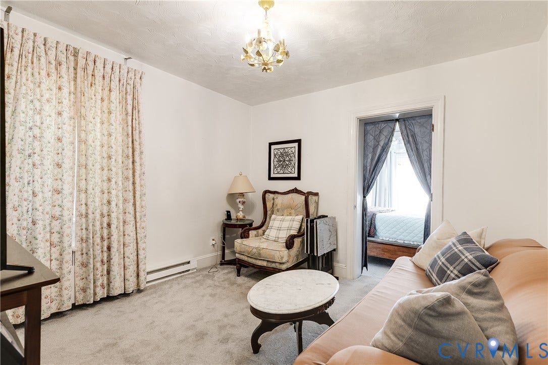 1406 Wentbridge Road, Richmond, VA 23227 Neutral wall-to-wall carpeting, decorative multi-arm chandelier, and classic door frame architecture