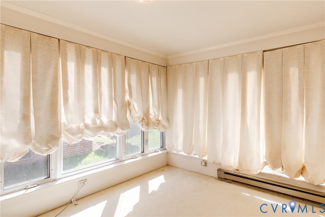 1406 Wentbridge Road, Richmond, VA 23227 Expansive corner window configuration with multi-pane glazing and neutral carpeting