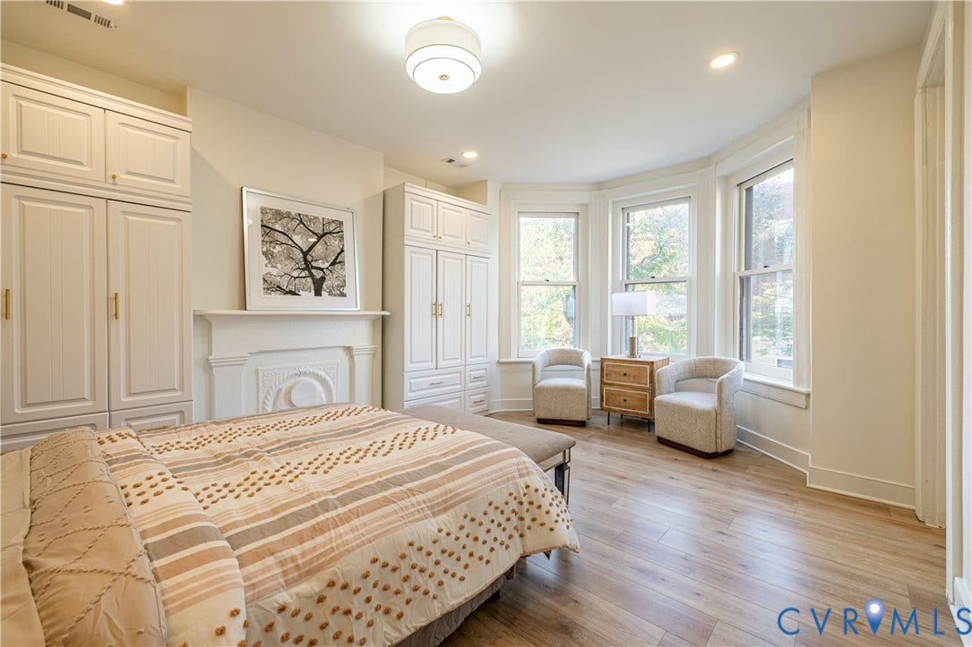 1108 W Marshall Street, Richmond, VA 23220 Wood-finish flooring, bay windows with natural light, decorative fireplace mantel, and built-in cabinetry with hardware finishes