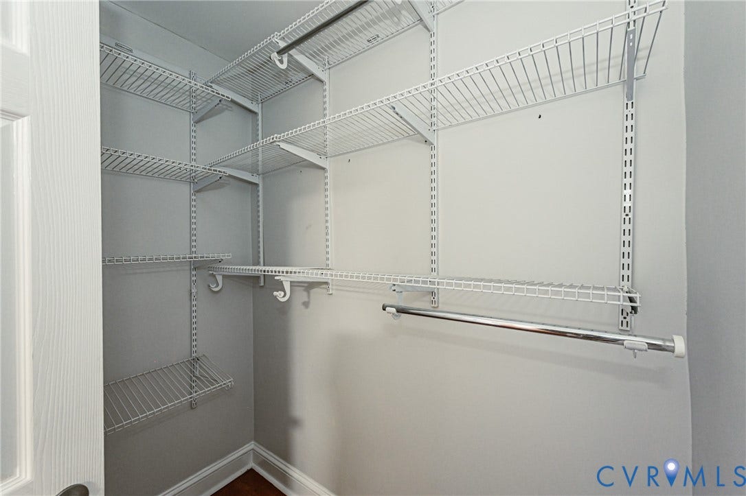 710 La Von Drive, Henrico, VA 23227 Walk-in closet featuring white wire shelving, wall-mounted adjustable tracks, and integrated garment rods