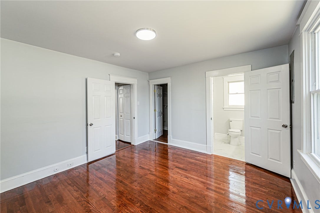 710 La Von Drive, Henrico, VA 23227 Room featuring wood-finish flooring, white six-panel interior doors, and neutral wall tones