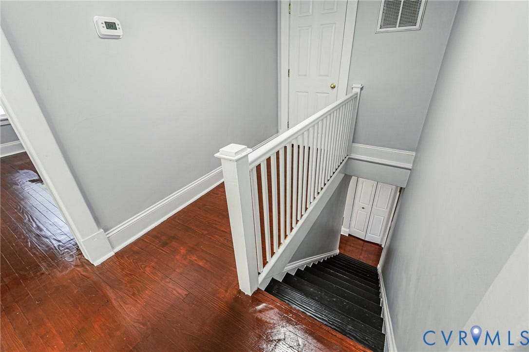 710 La Von Drive, Henrico, VA 23227 Wood-finish flooring, white spindle staircase railing, and painted interior doors