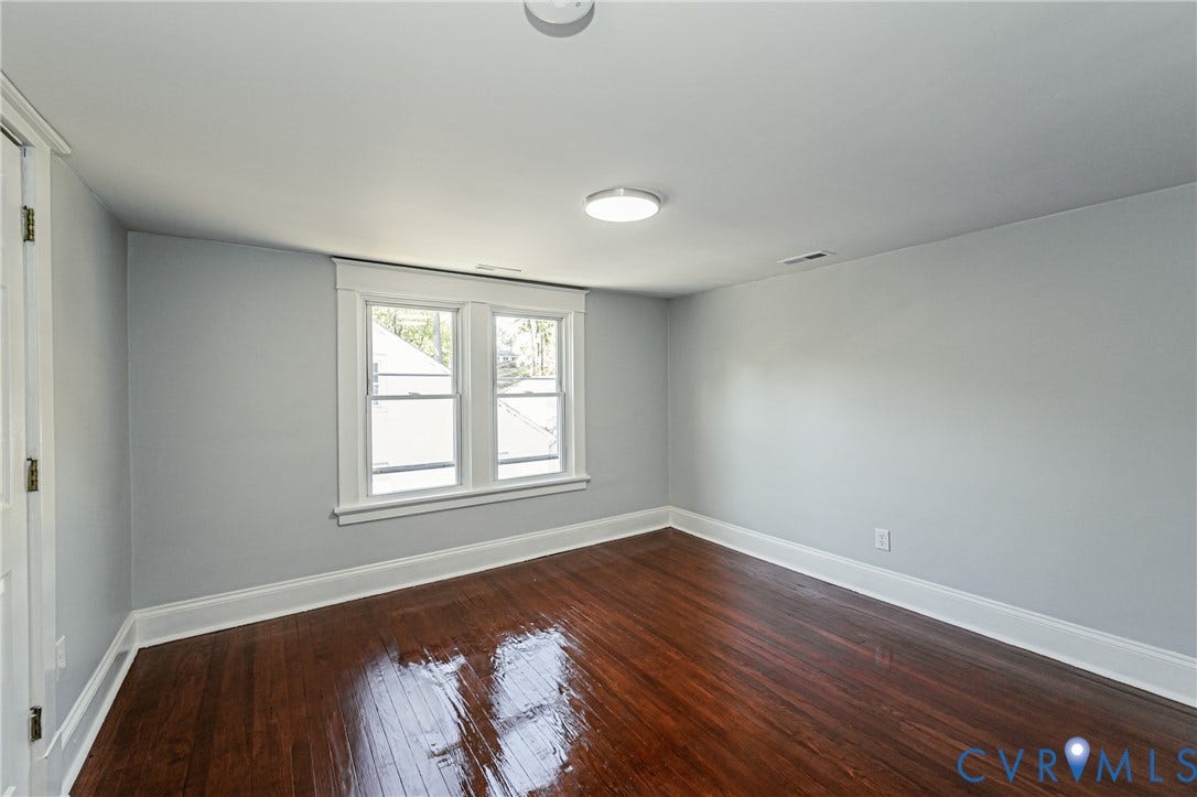 710 La Von Drive, Henrico, VA 23227 Refinished wood-finish flooring, neutral wall tones, double-pane window with traditional molding, and overhead flush-mount lighting
