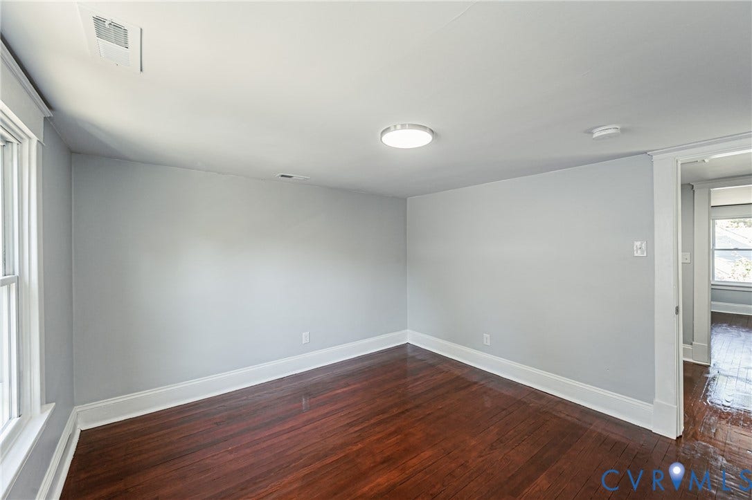 710 La Von Drive, Henrico, VA 23227 Room featuring wood-finish flooring, neutral wall paint, and overhead flush-mount lighting