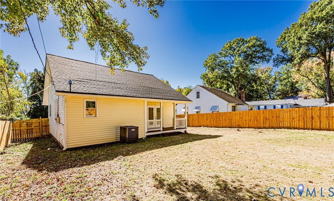 710 La Von Drive, Henrico, VA 23227 Exterior view featuring vinyl siding, an asphalt shingle roof, double entry doors, a covered porch, and wood privacy fencing