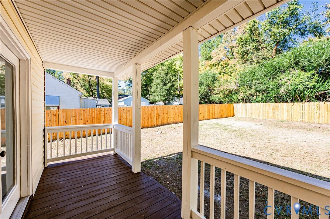 710 La Von Drive, Henrico, VA 23227 Covered wooden deck featuring white railings and a fenced backyard