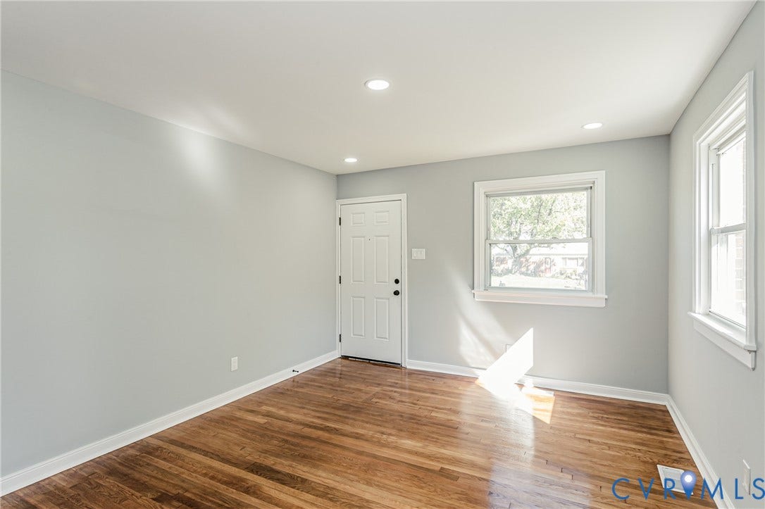 506 Meadowspring Road, Henrico, VA 23223 Interior space featuring light-toned neutral walls, wood-finish flooring, recessed lighting, and white-trimmed windows