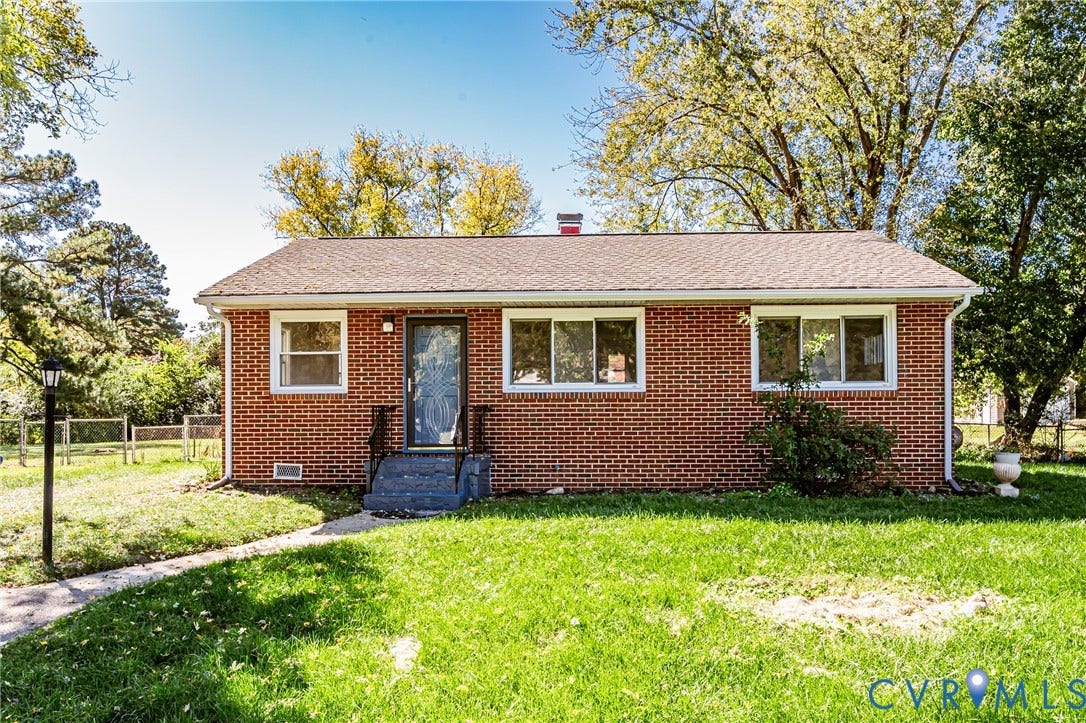 506 Meadowspring Road, Henrico, VA 23223 Red brick exterior featuring a pitched roof, multi-pane windows, and concrete front entry steps
